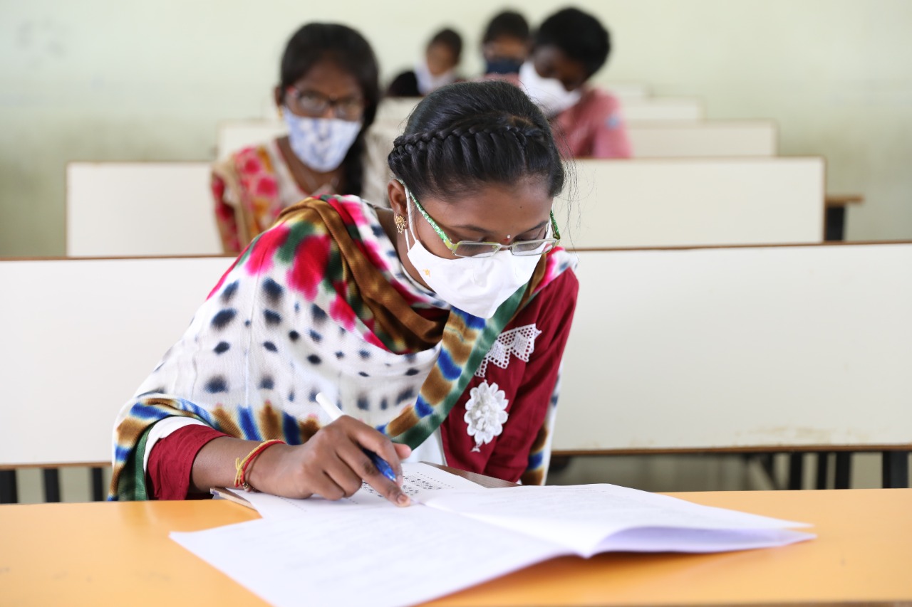 A girl hard at work on her scholarship exam